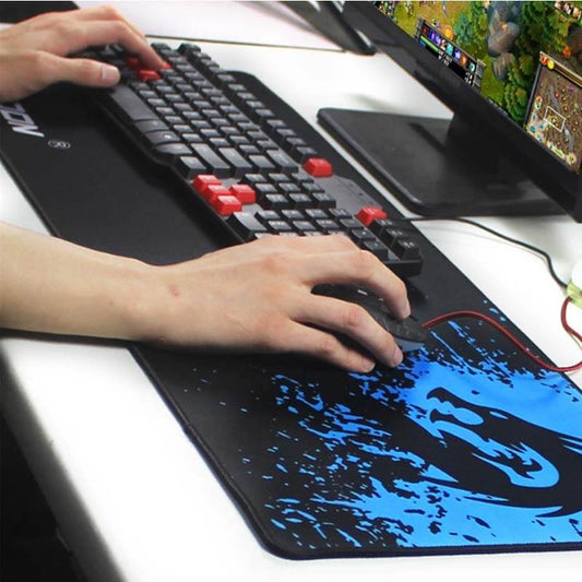 Gaming mouse pad in use with keyboard, featuring smooth surface and non-slip design for precise movements.